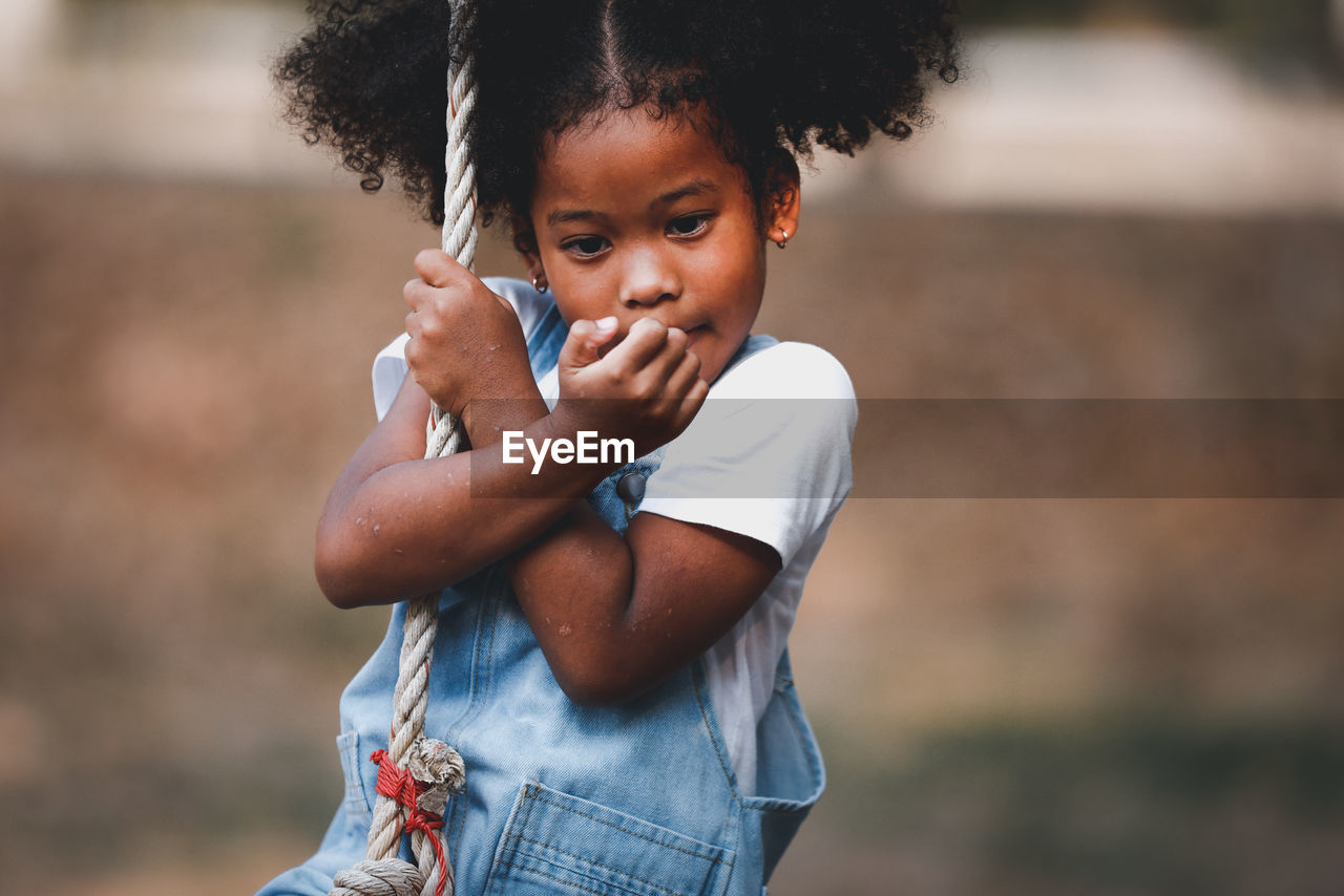 Portrait of girl standing outdoors