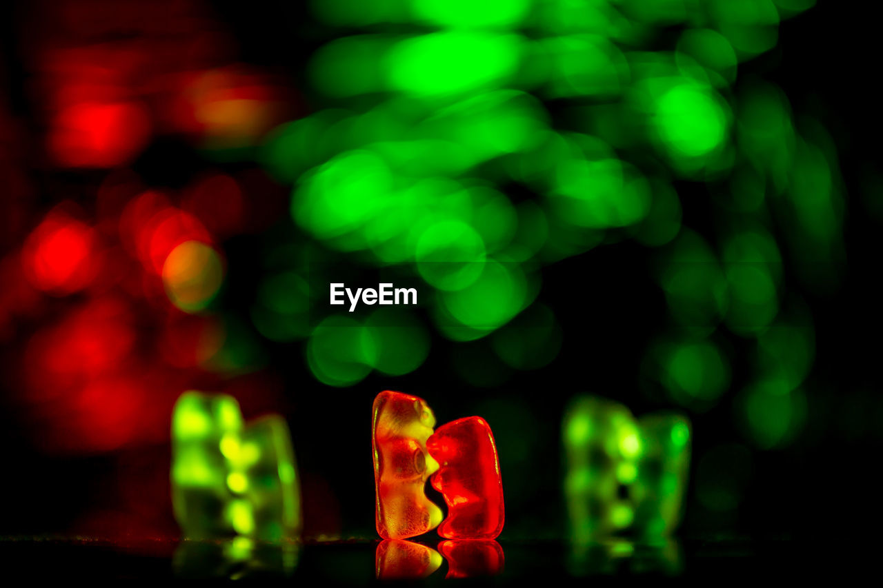 CLOSE-UP OF MULTI COLORED LIGHTS ON FLOOR