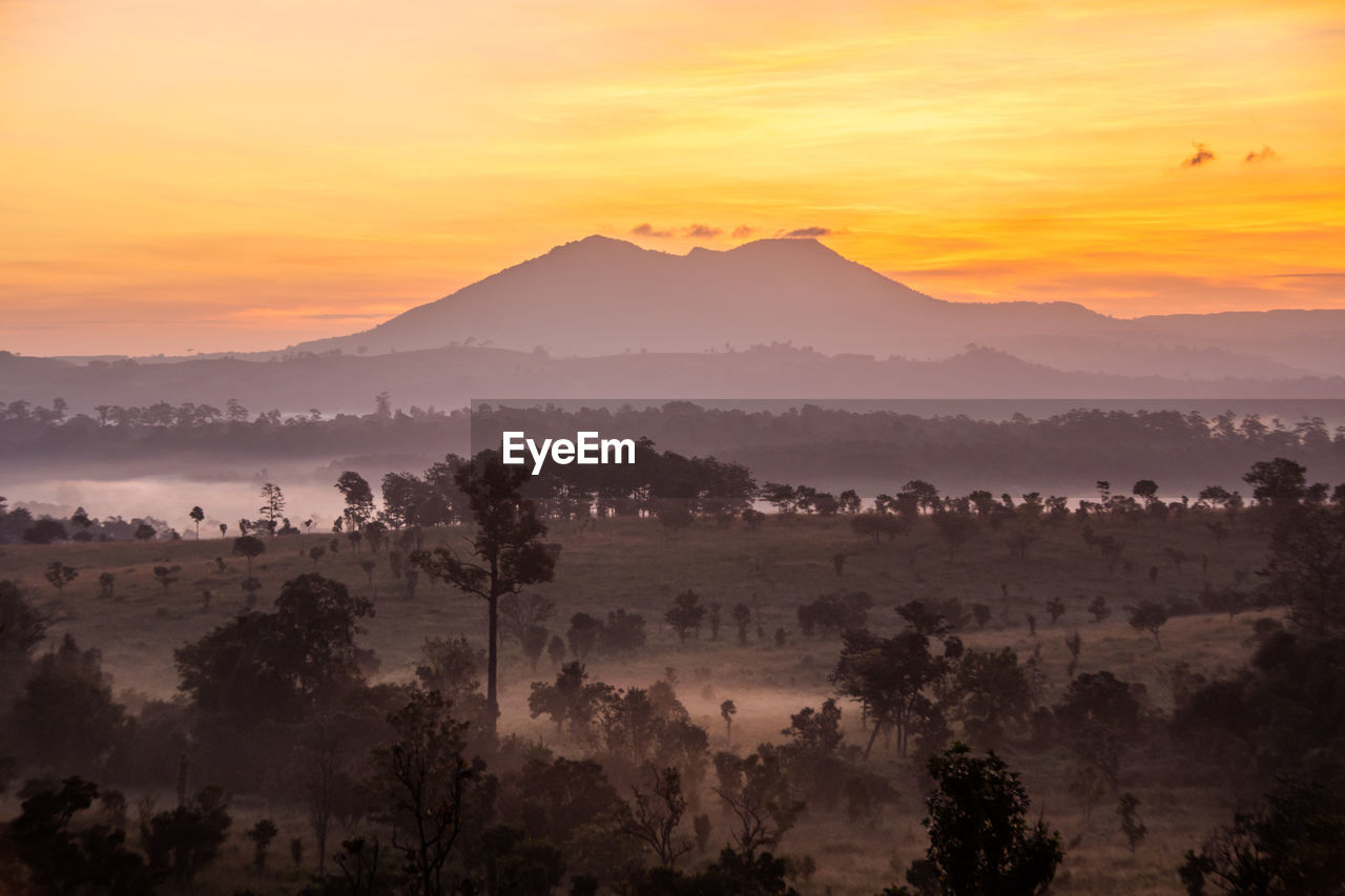 SCENIC VIEW OF MOUNTAINS DURING SUNSET