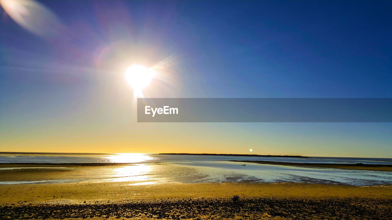 Scenic view of sea against sky at sunset