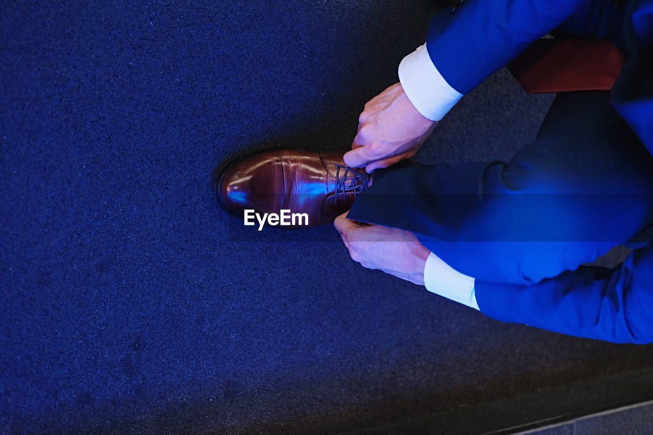 Directly above shot of man wearing dress shoe