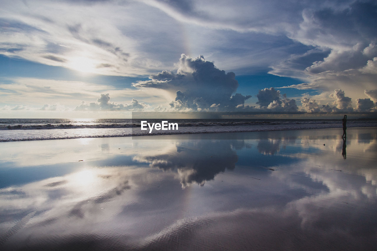 Scenic view of sea against sky at sunset