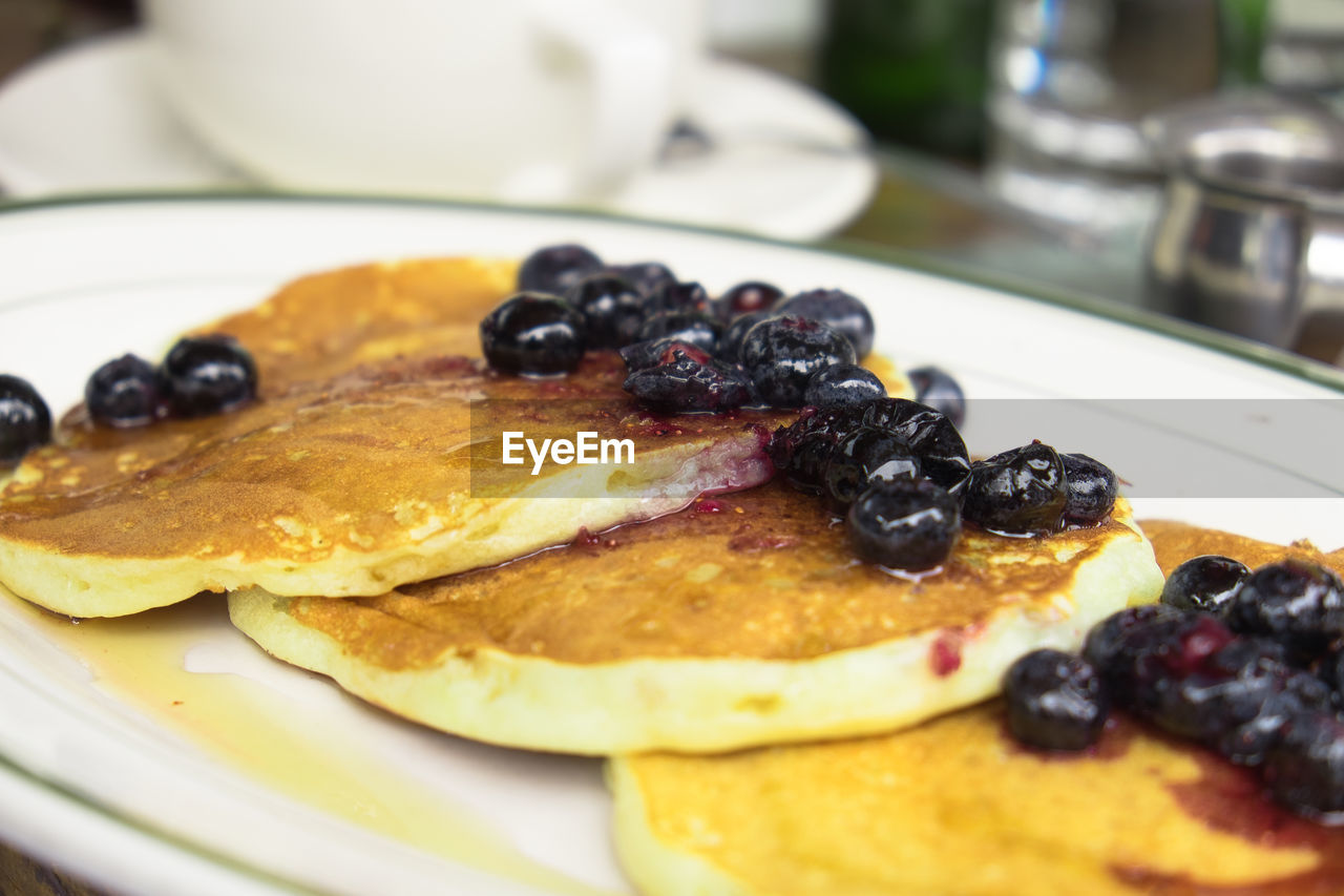 Close-up of pancakes in plate on table