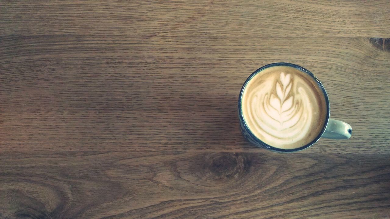 HIGH ANGLE VIEW OF COFFEE ON TABLE AT HOME