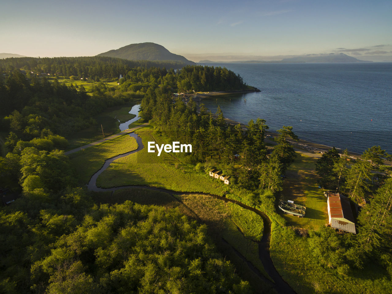 HIGH ANGLE VIEW OF GOLF COURSE ON SEA