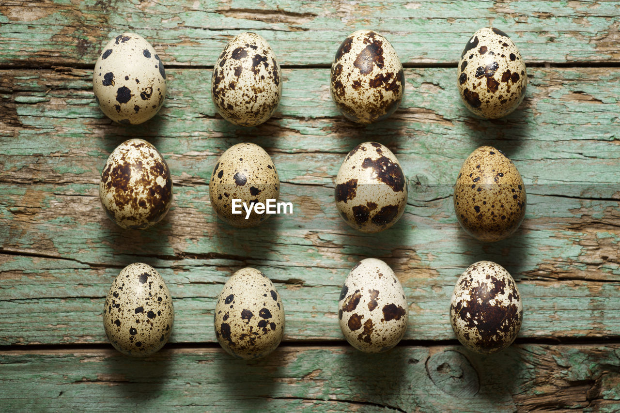 Quail eggs on a wooden table.