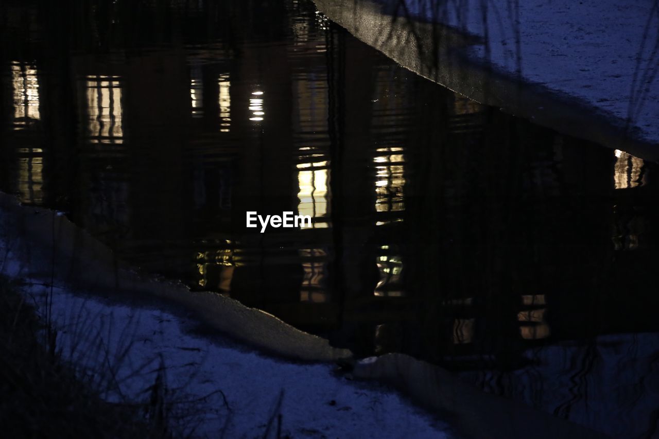 ILLUMINATED BUILDING COVERED WITH SNOW