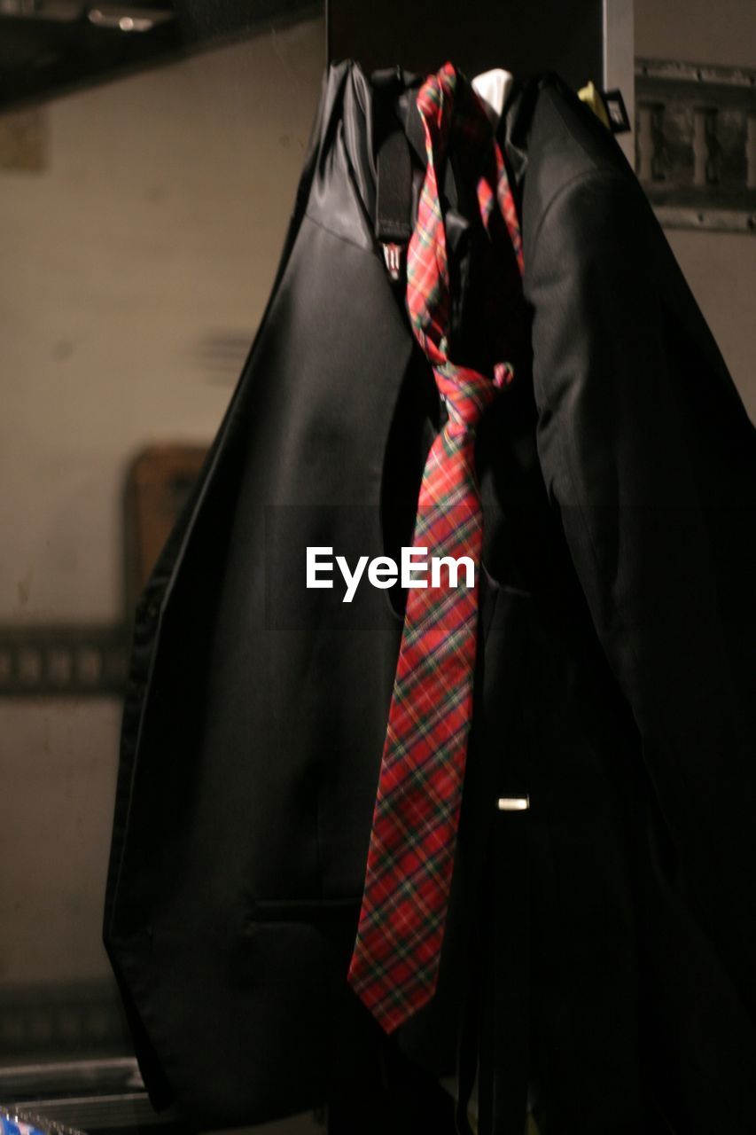 Close-up of suit and necktie on backstage