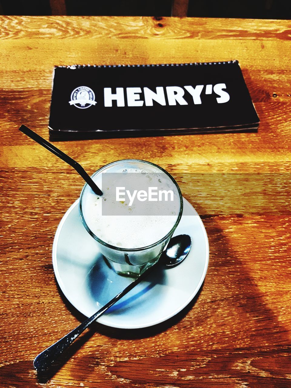 HIGH ANGLE VIEW OF COFFEE ON TABLE WITH TEXT