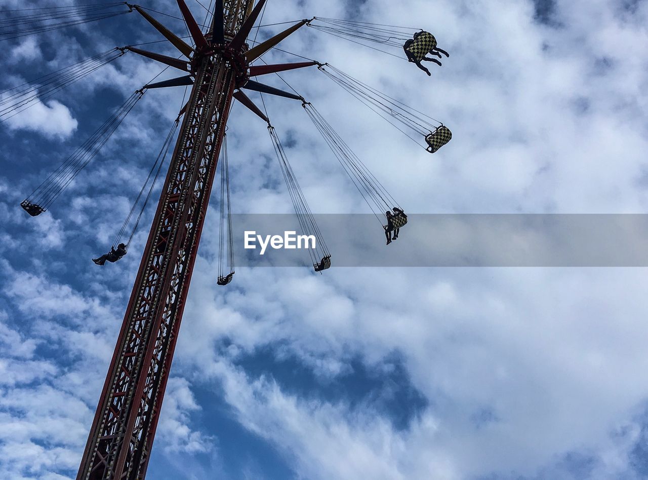 LOW ANGLE VIEW OF CHAIN SWING RIDE