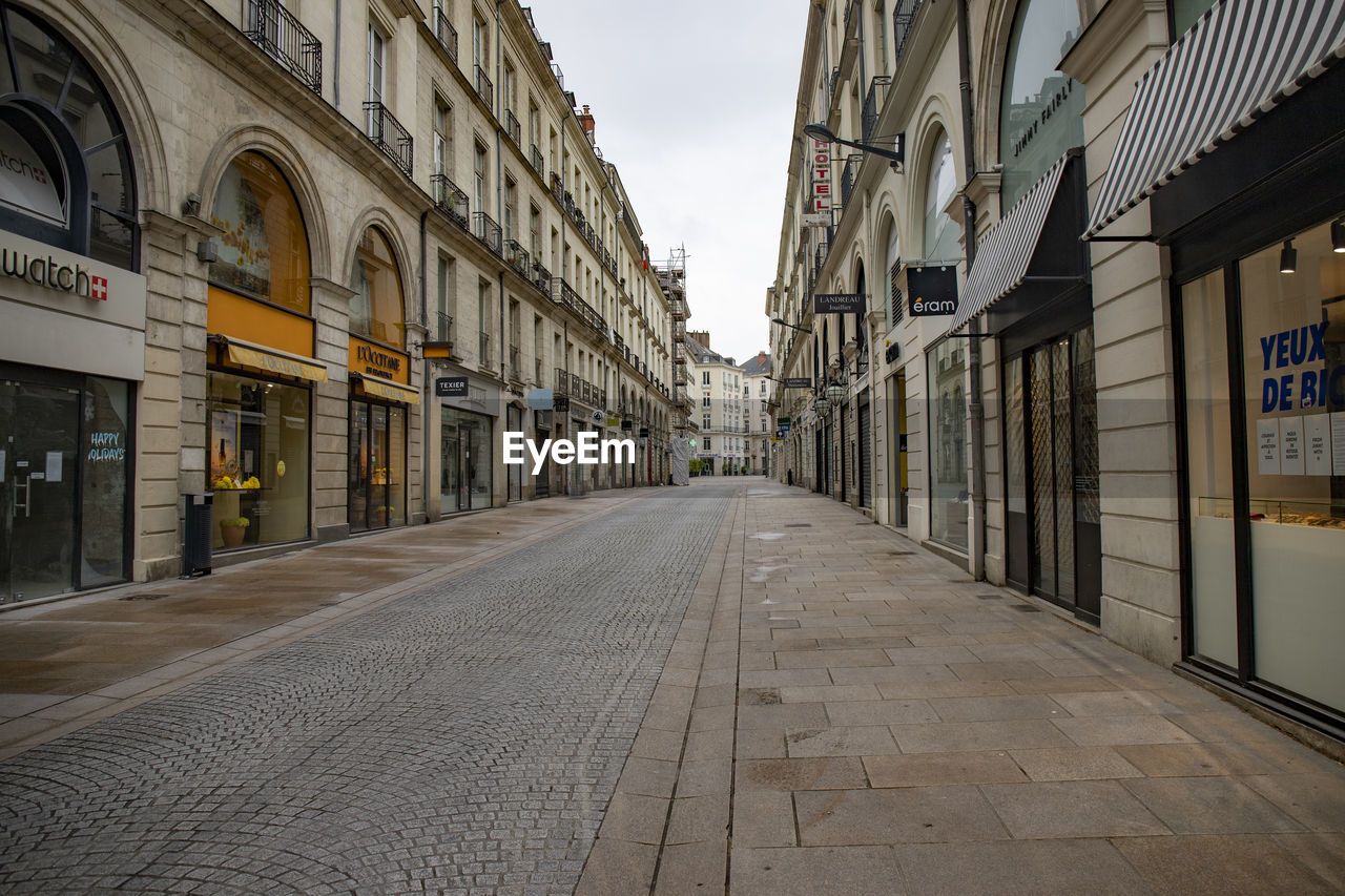 STREET AMIDST BUILDINGS IN CITY