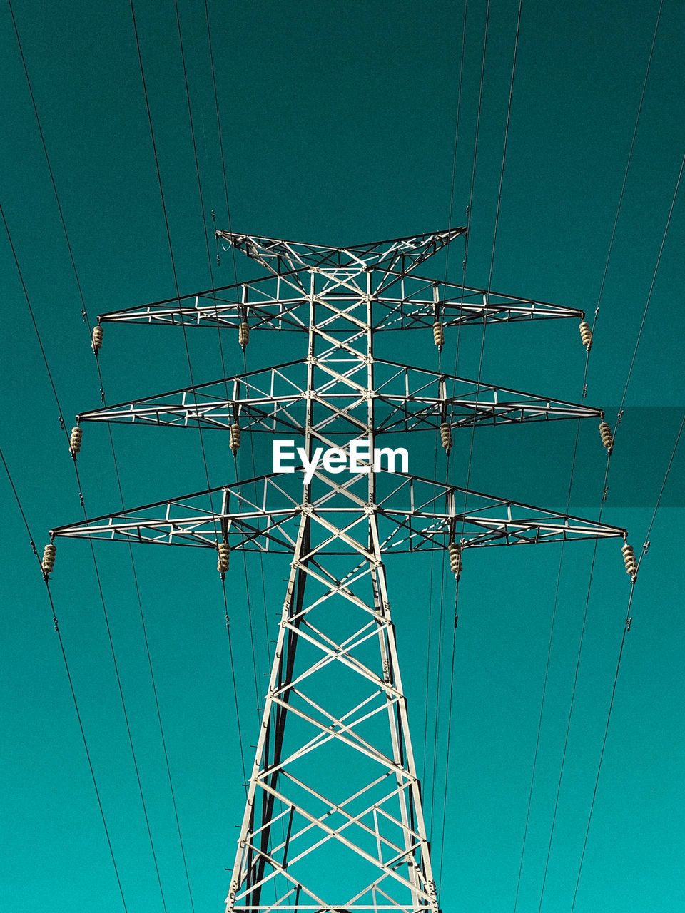 low angle view of electricity pylon against sky at dusk