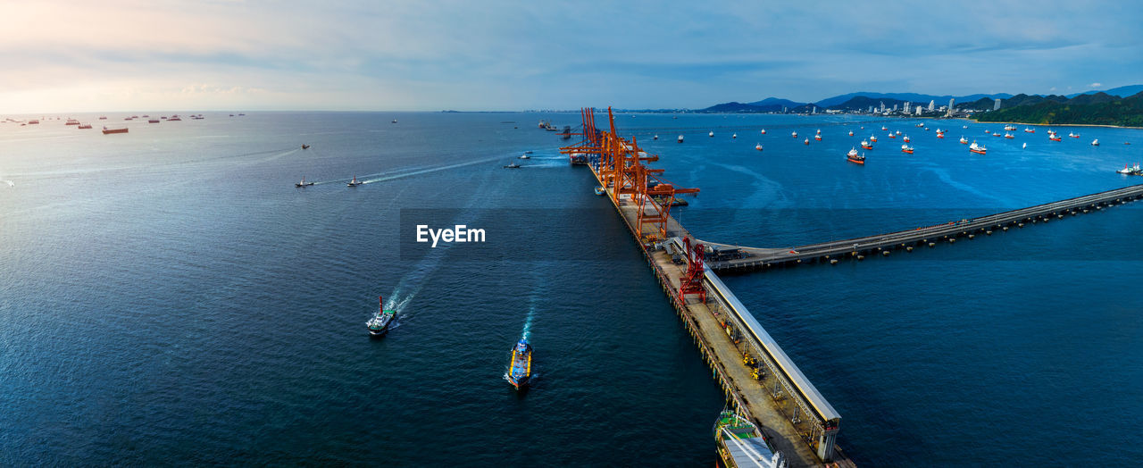 high angle view of boats in sea against sky