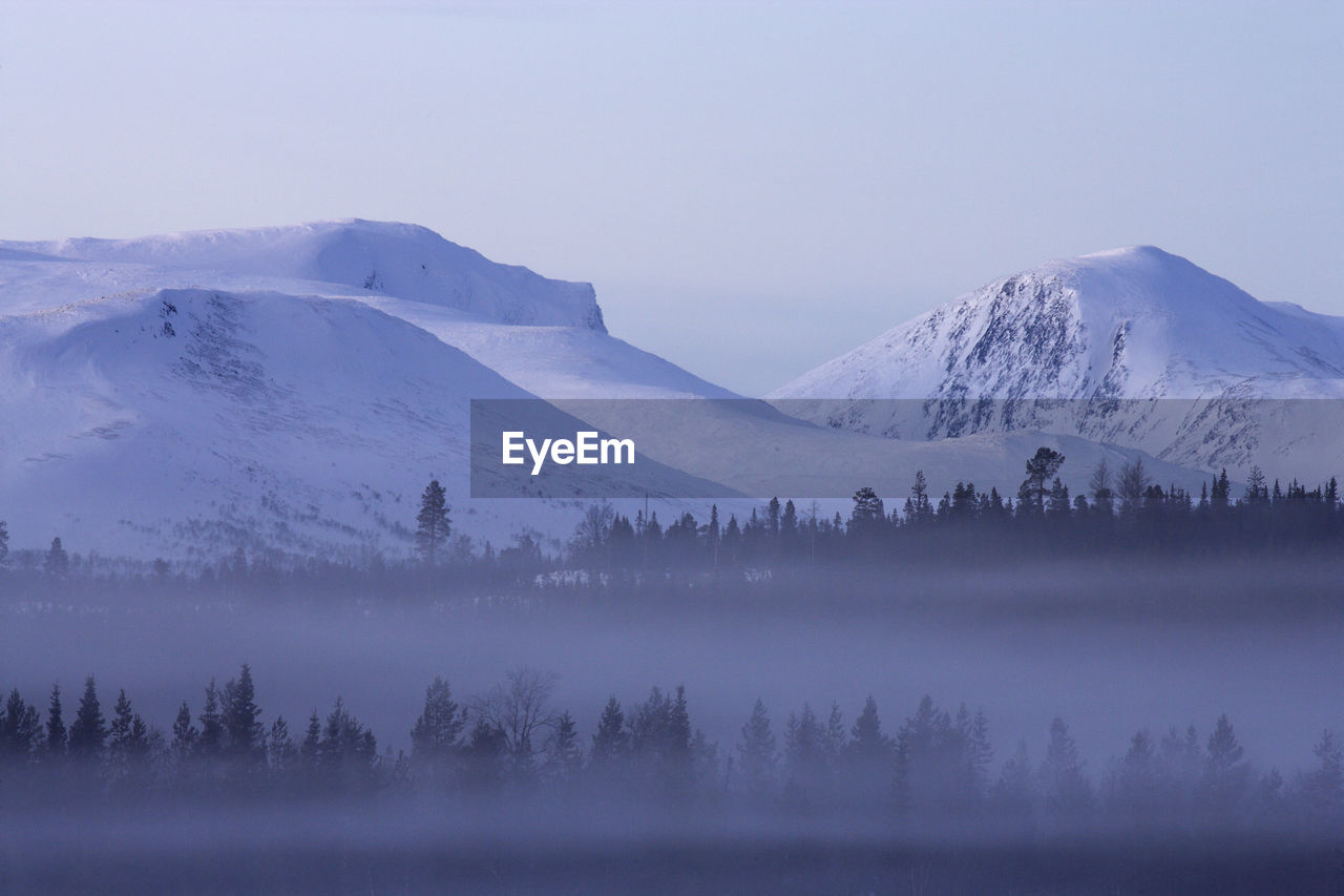 Scenic view of snow covered mountain