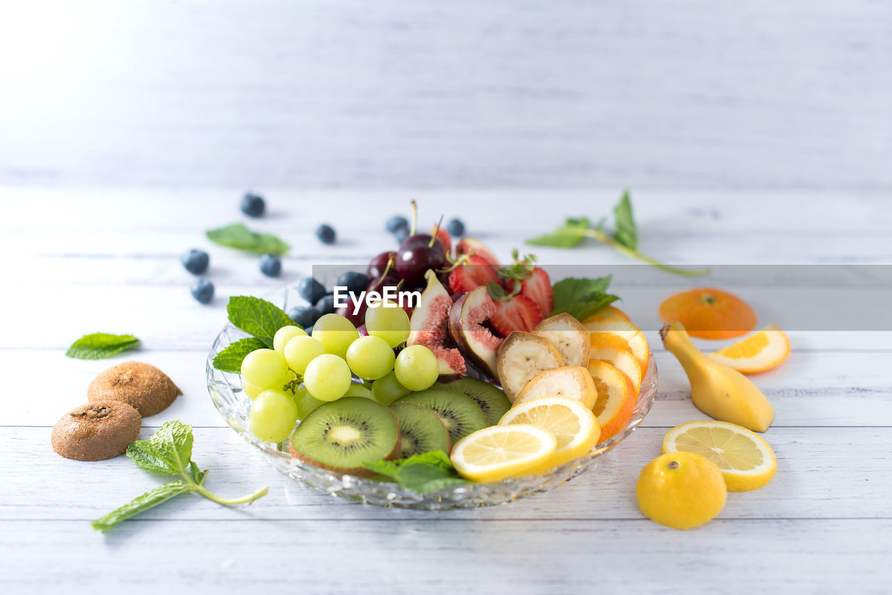 Close-up of fruits in plate on table