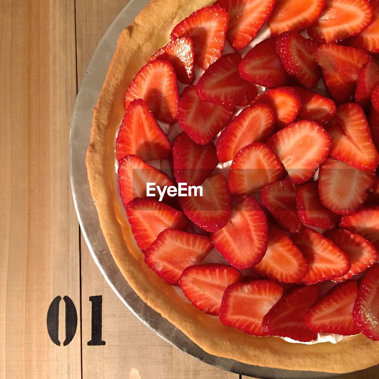 Directly above shot of strawberry tart on table