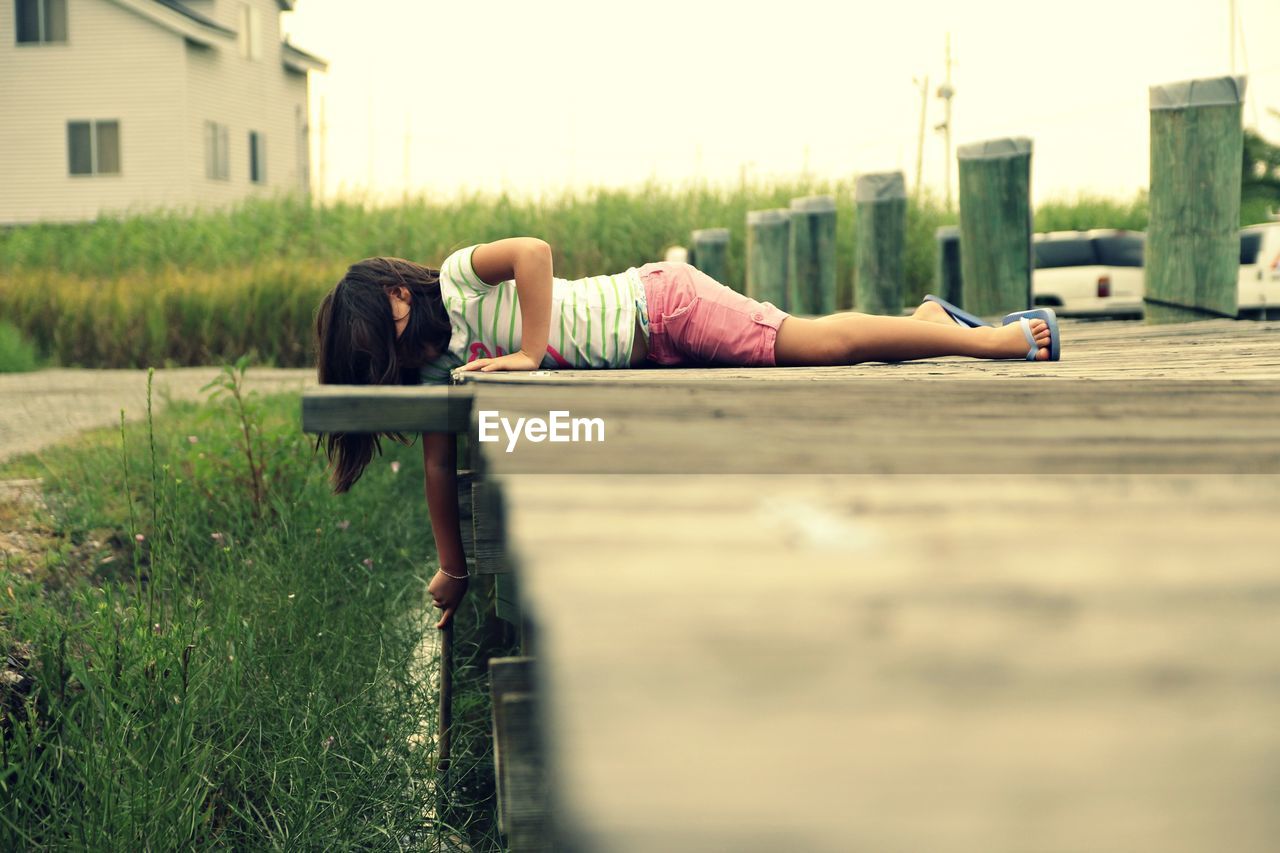 MAN LYING DOWN ON GRASS