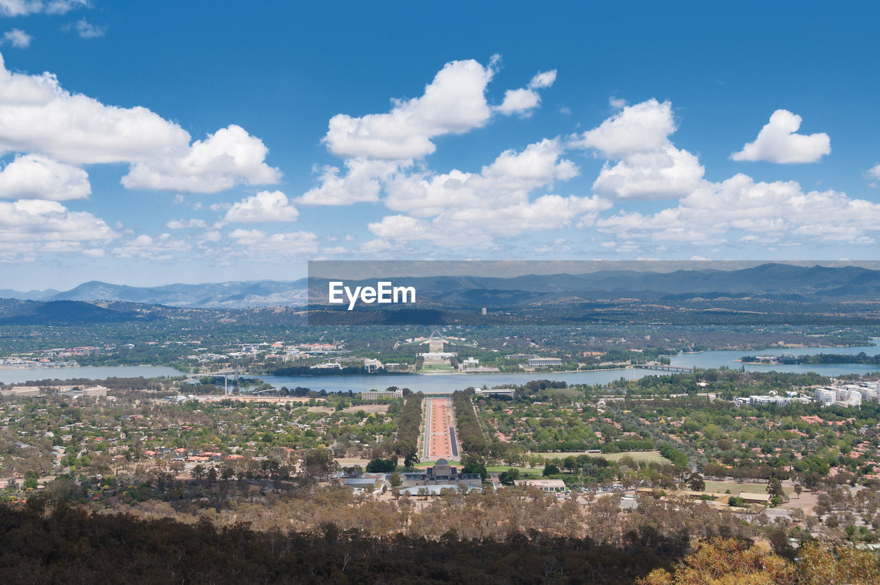 Aerial view of canberra australian capital city with griffin lake and suburbs.