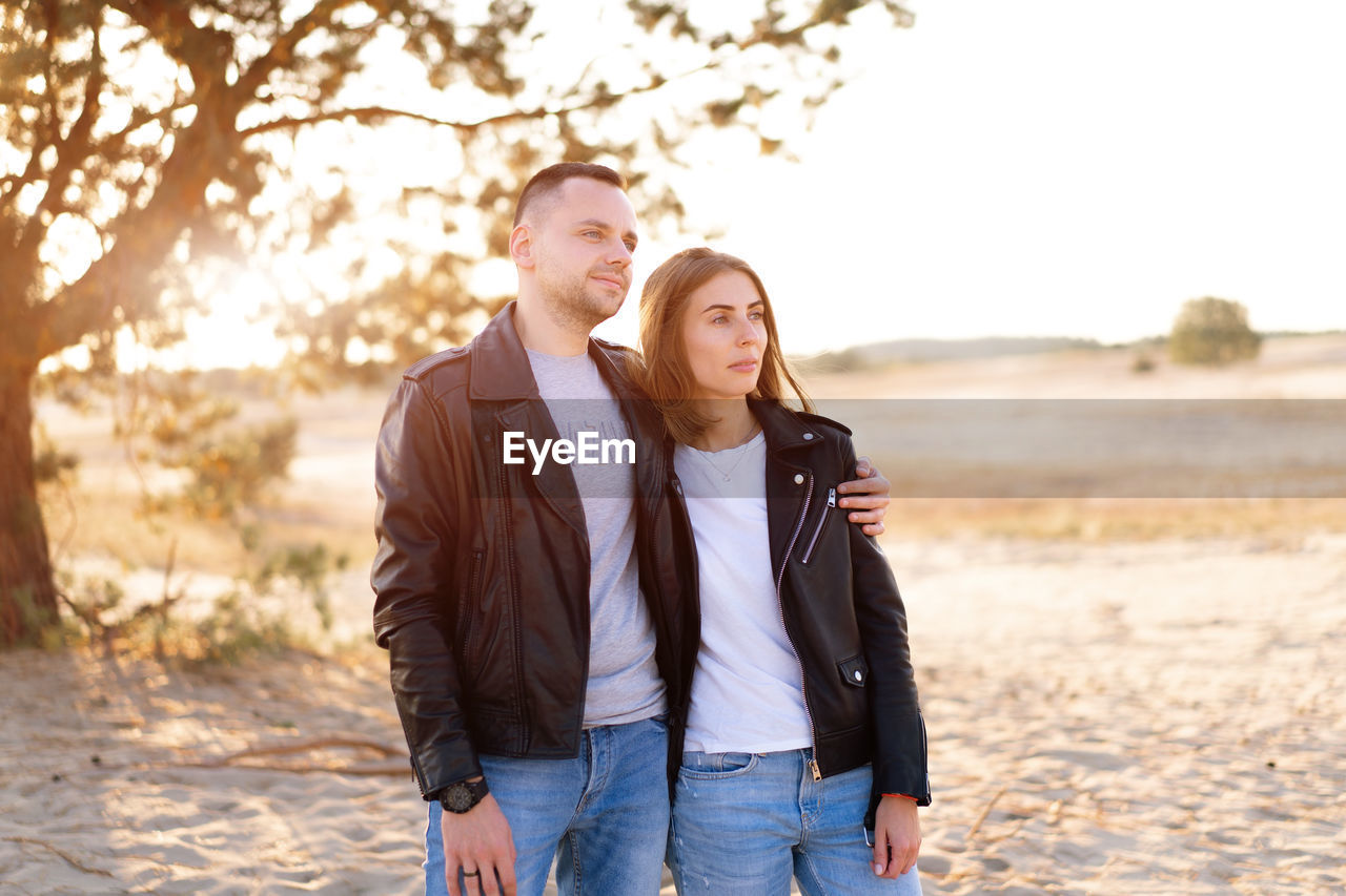 Young couple standing at desert