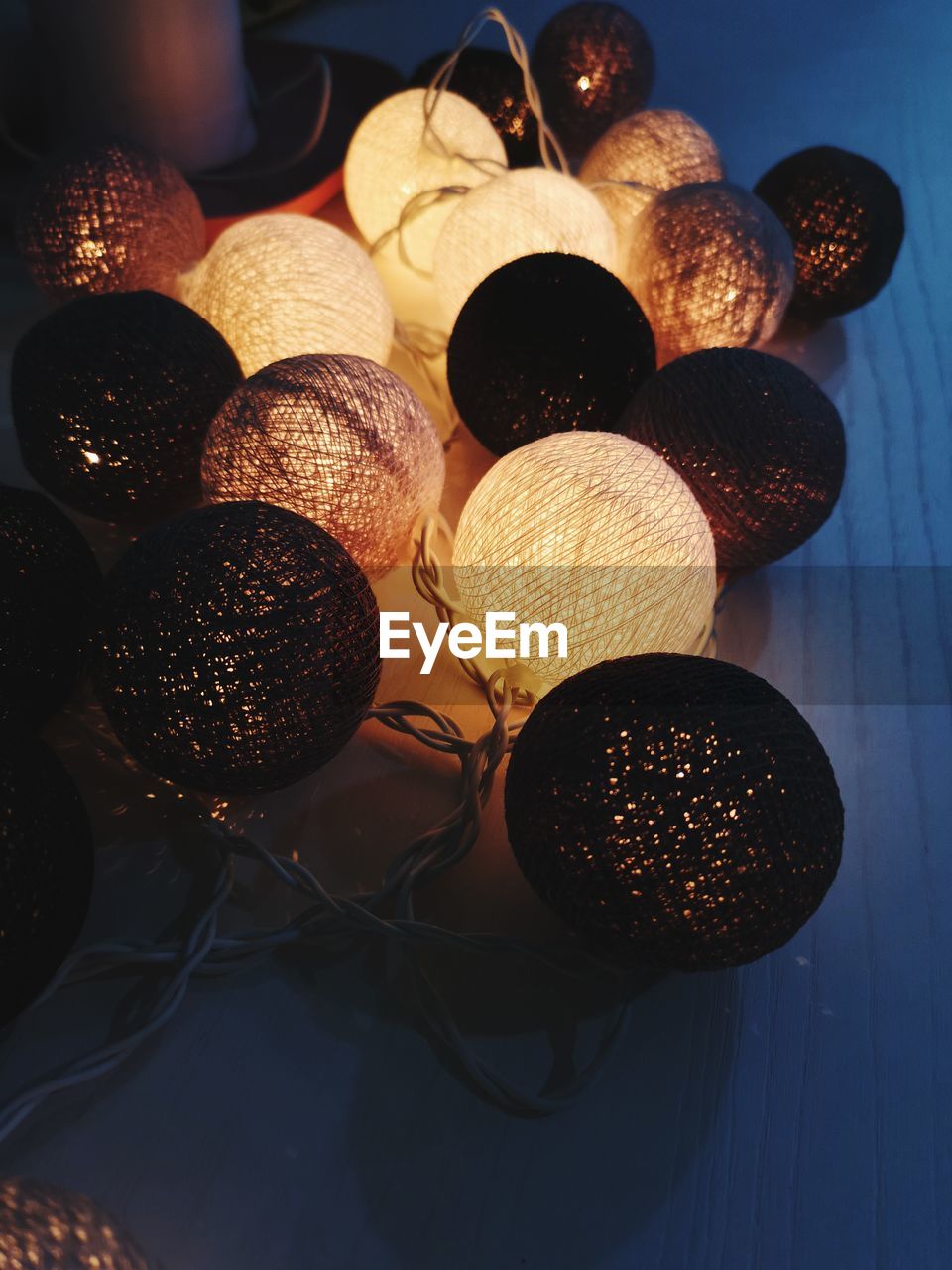 Close-up of illuminated lighting equipment on table