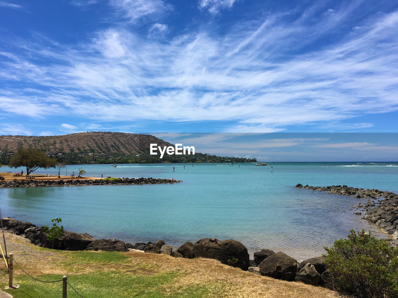 Scenic view of sea against blue sky