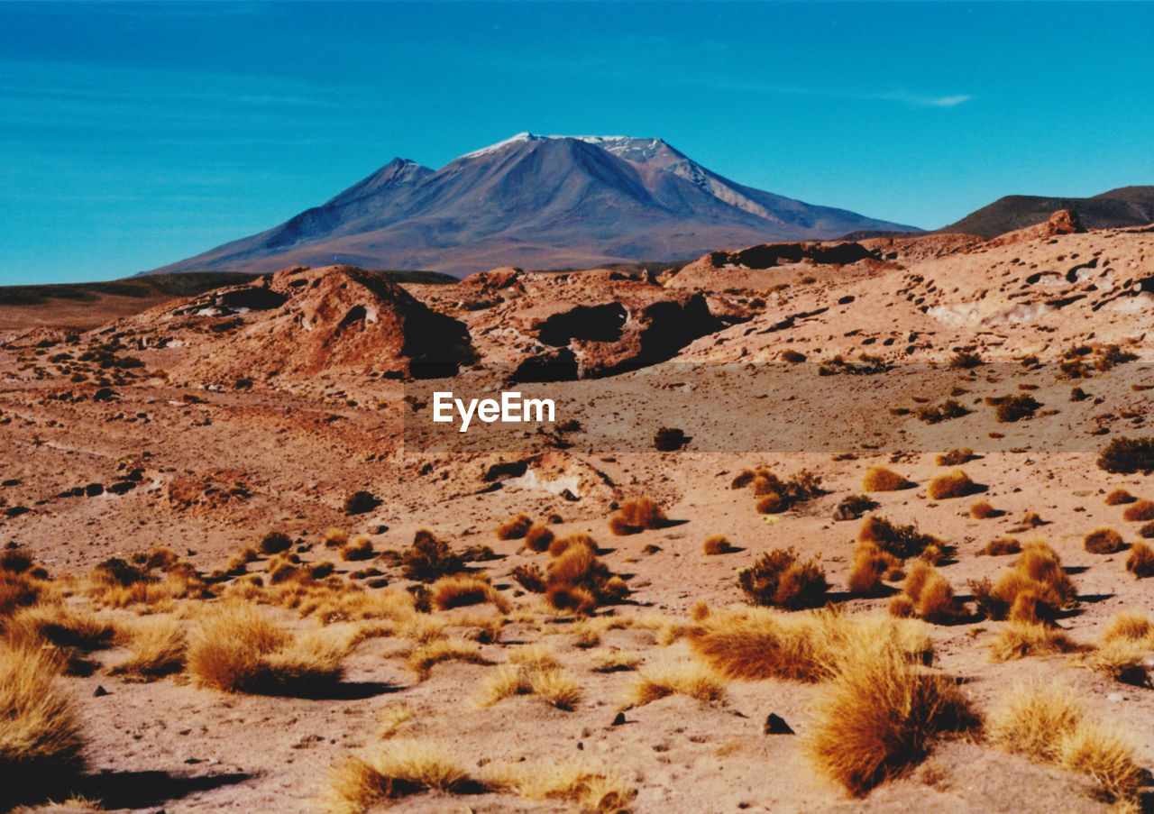 Scenic view of desert against clear sky