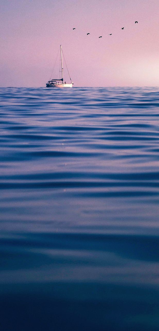 Scenic view of sea against sky at sunset