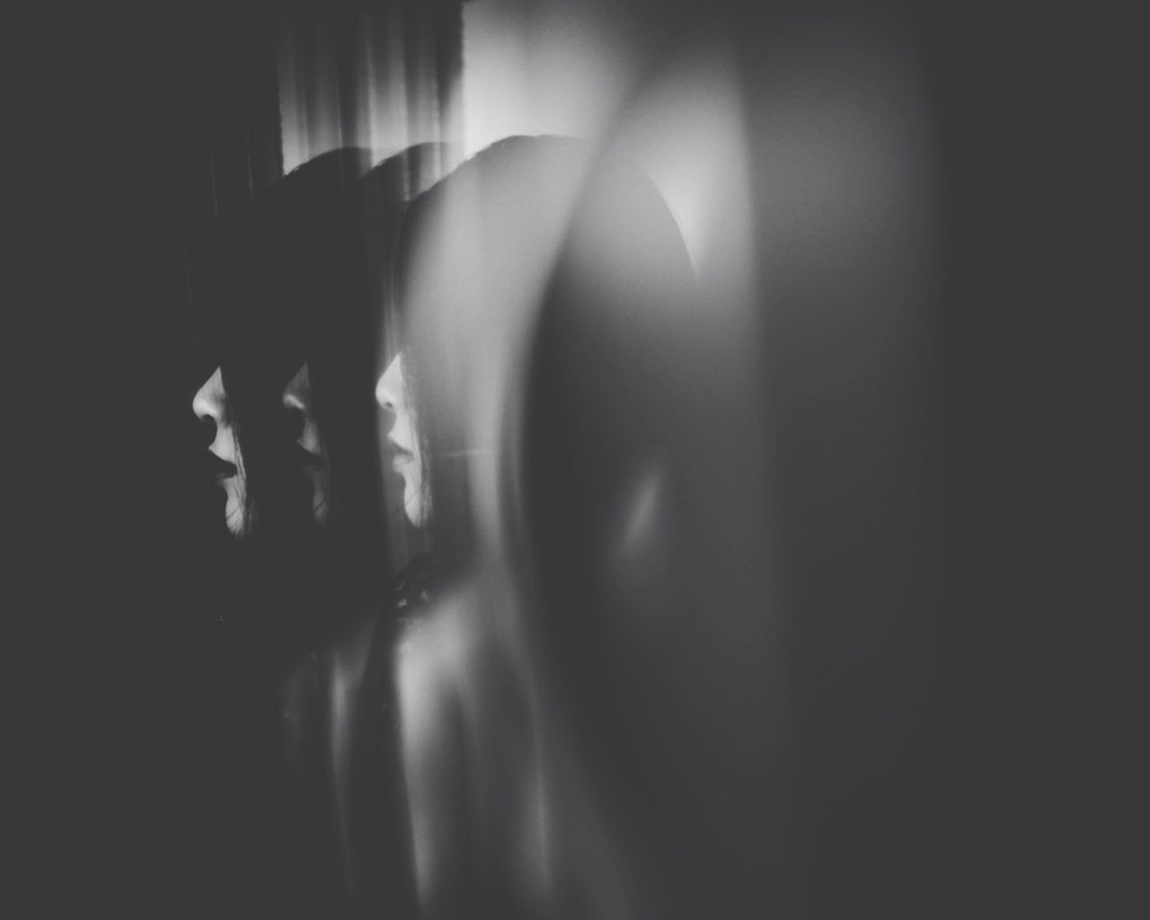 Multiple exposure of woman in the dark