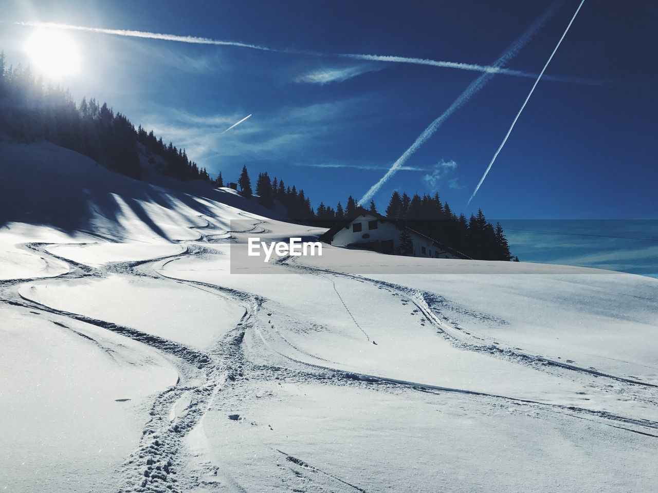 Scenic view of snow covered mountain against sky