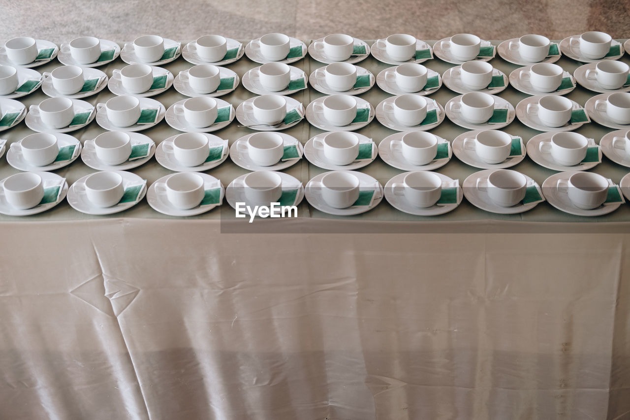 Empty coffee cup for wedding banquet conference seminar catering event. tea coffee break service