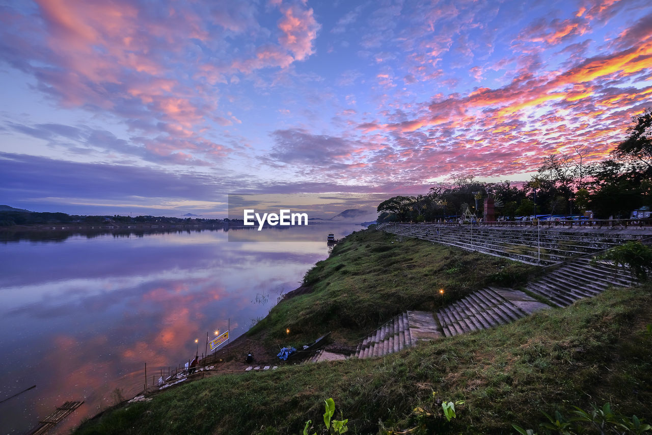 Scenic view of lake against sky during sunset