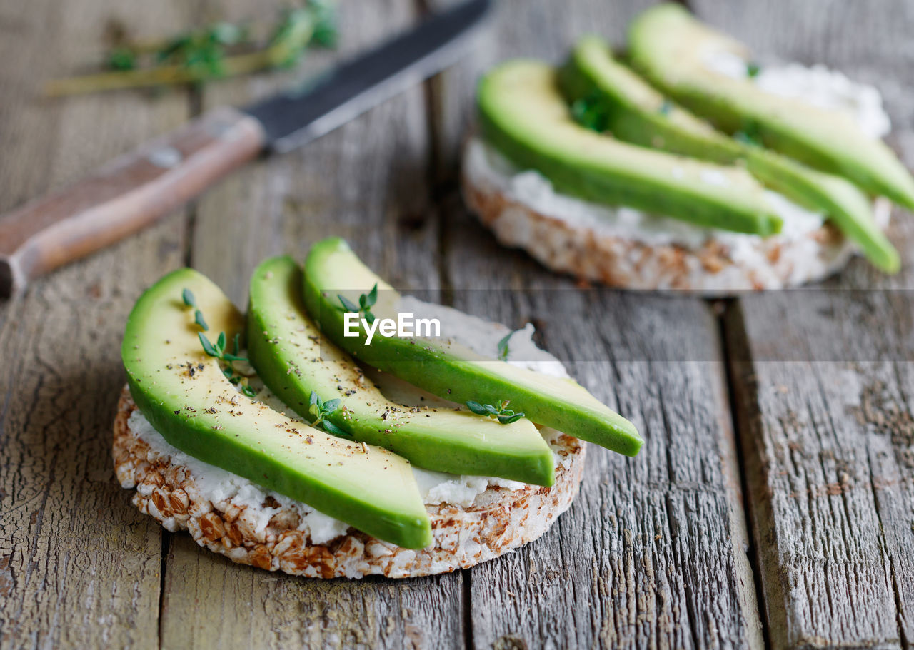 Close-up of avocado on food at table