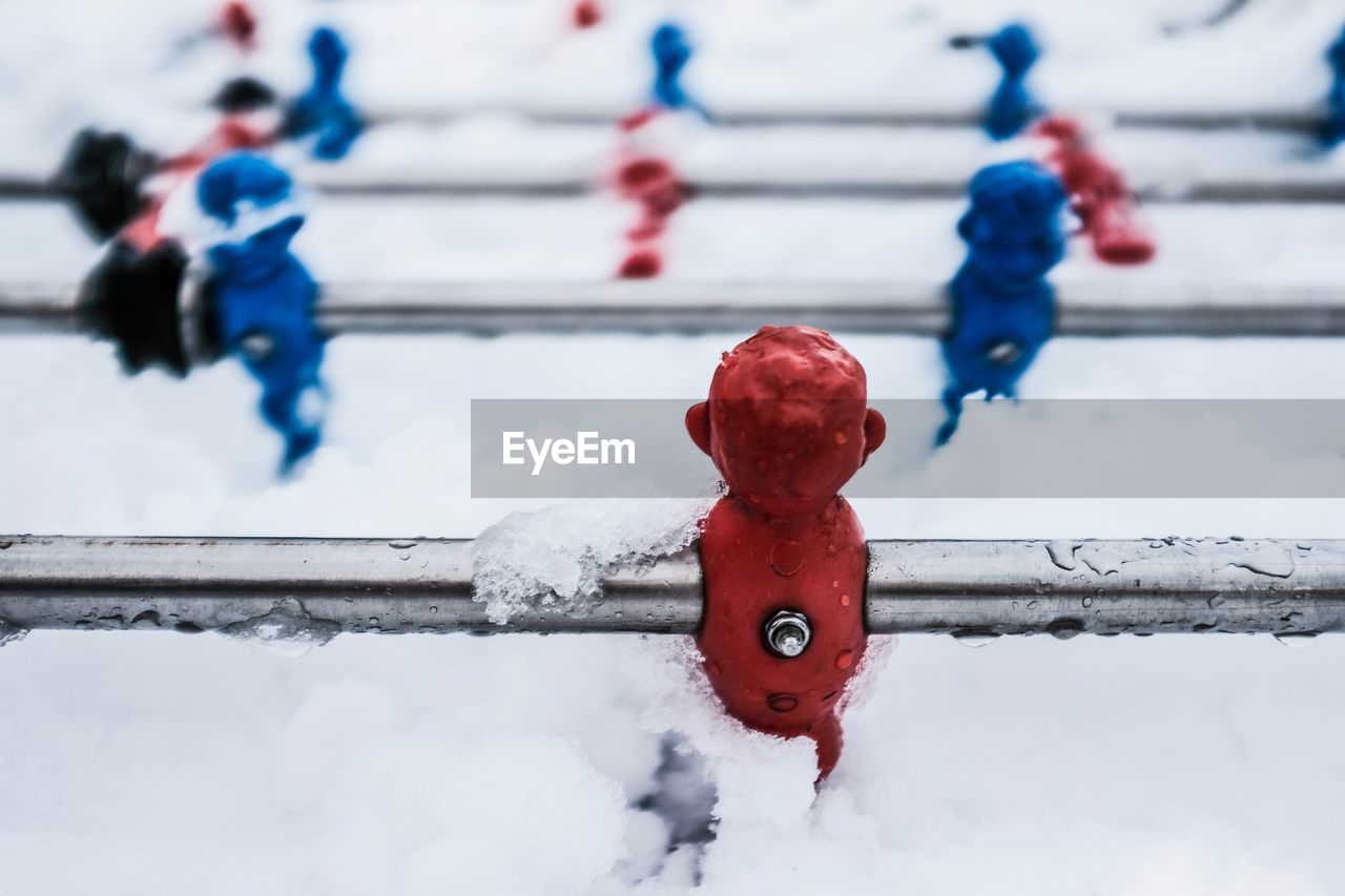 Close-up of snow covered foosball
