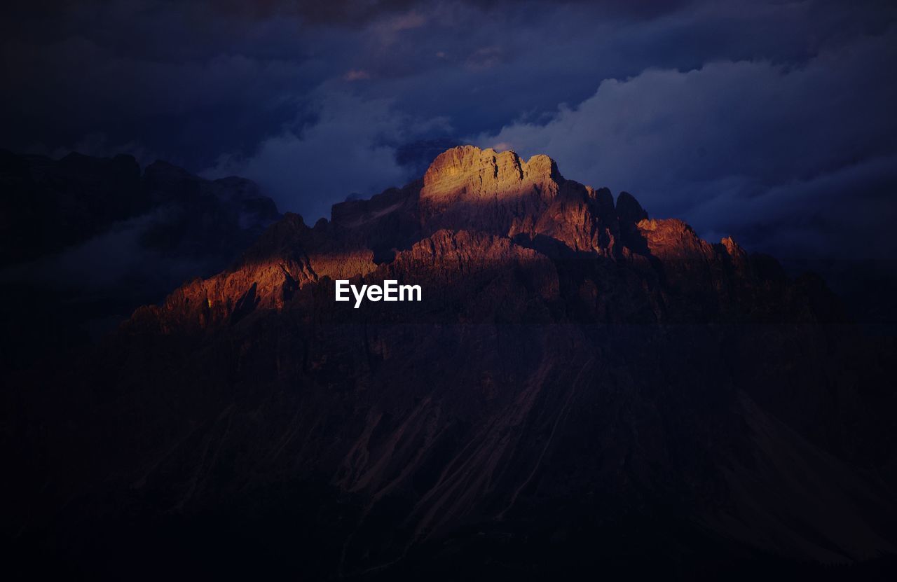 Low angle view of rock formation against sky