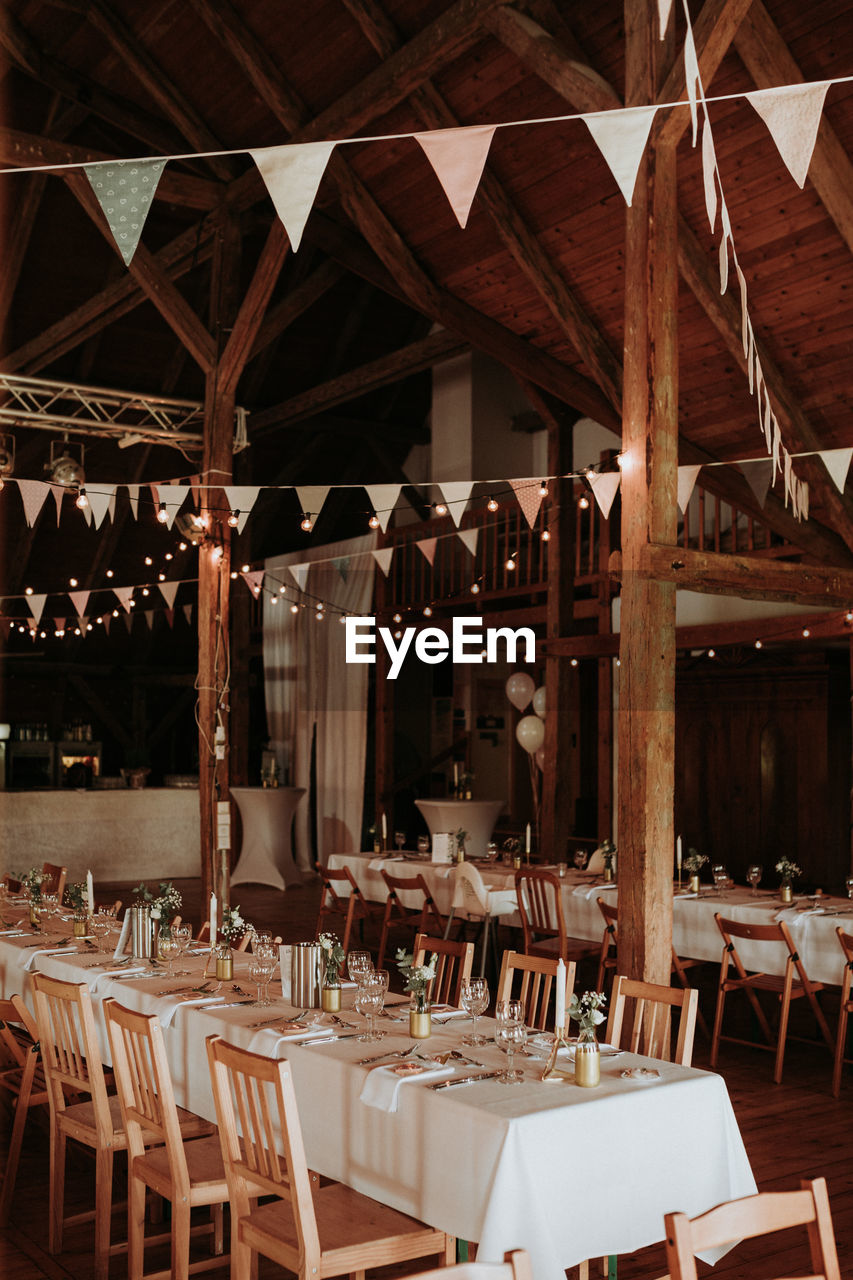 Empty chairs and tables in restaurant / wedding inspiration