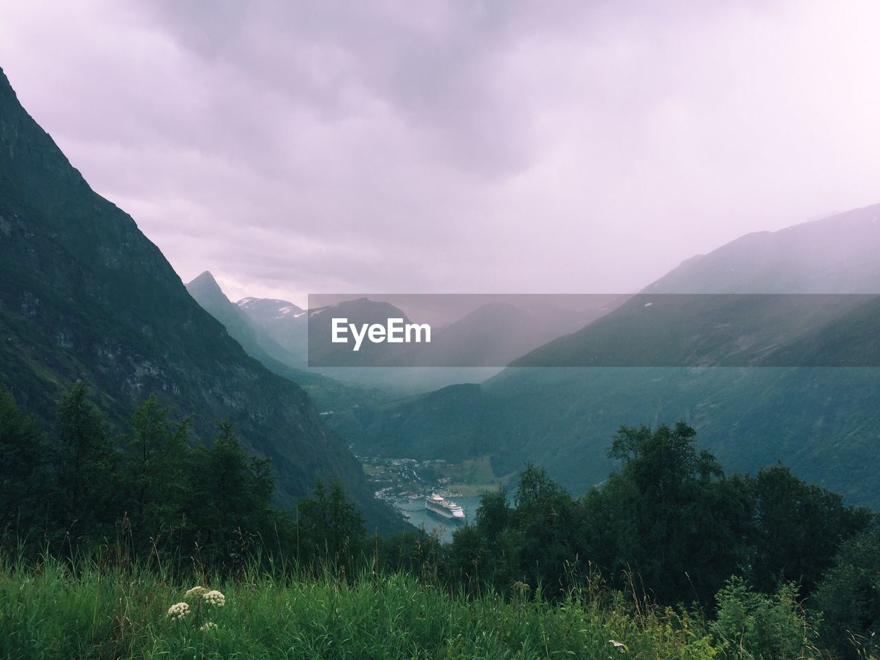 Geiranger fjord and village on a rainy day, in norway