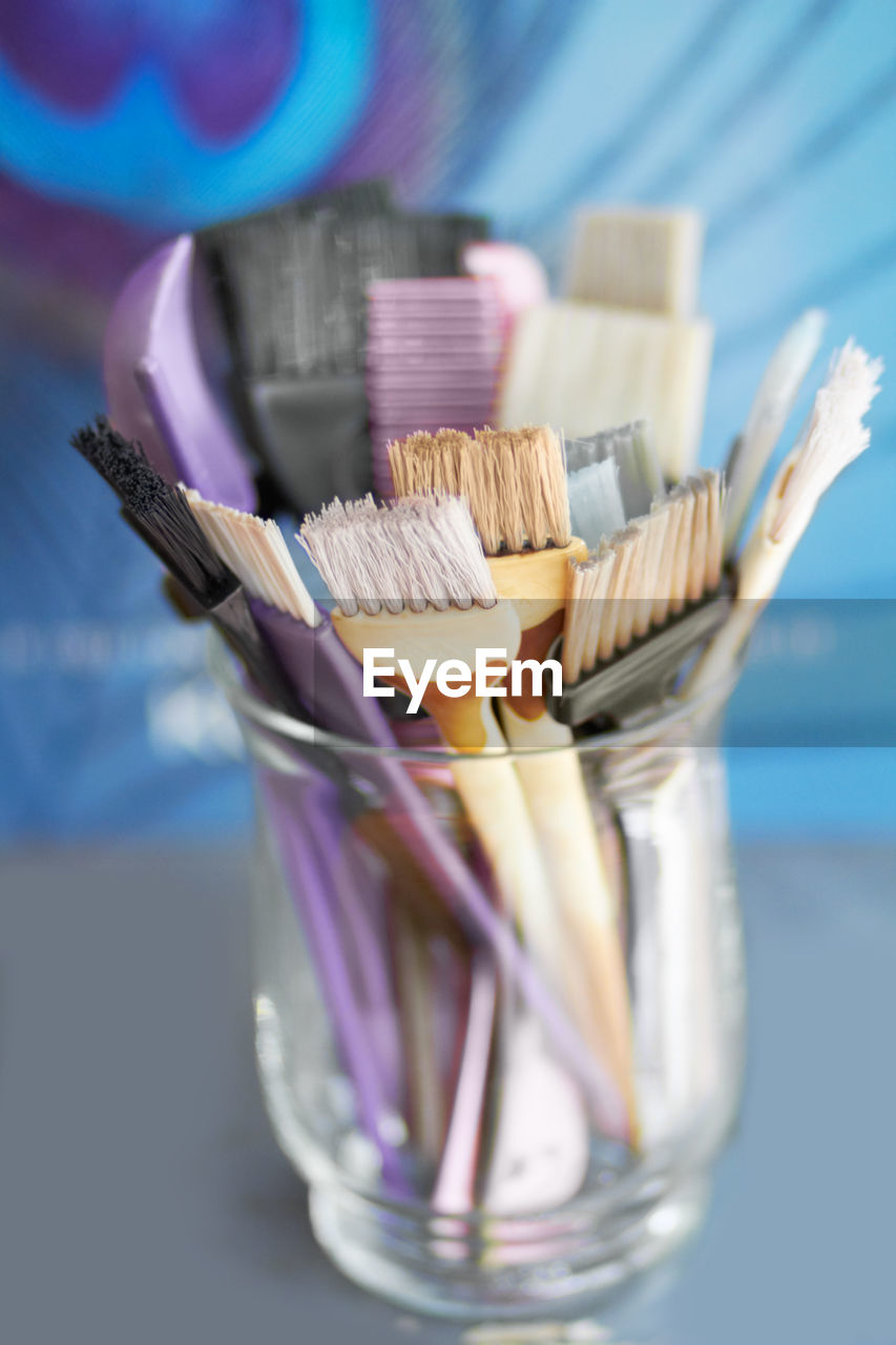 close-up of paintbrushes in container