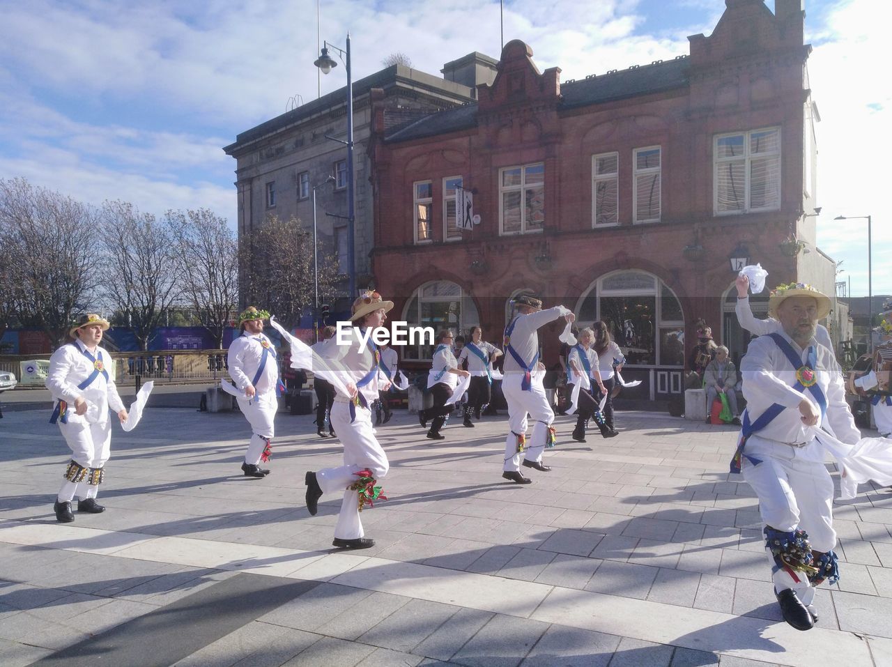 GROUP OF PEOPLE ON STREET IN CITY