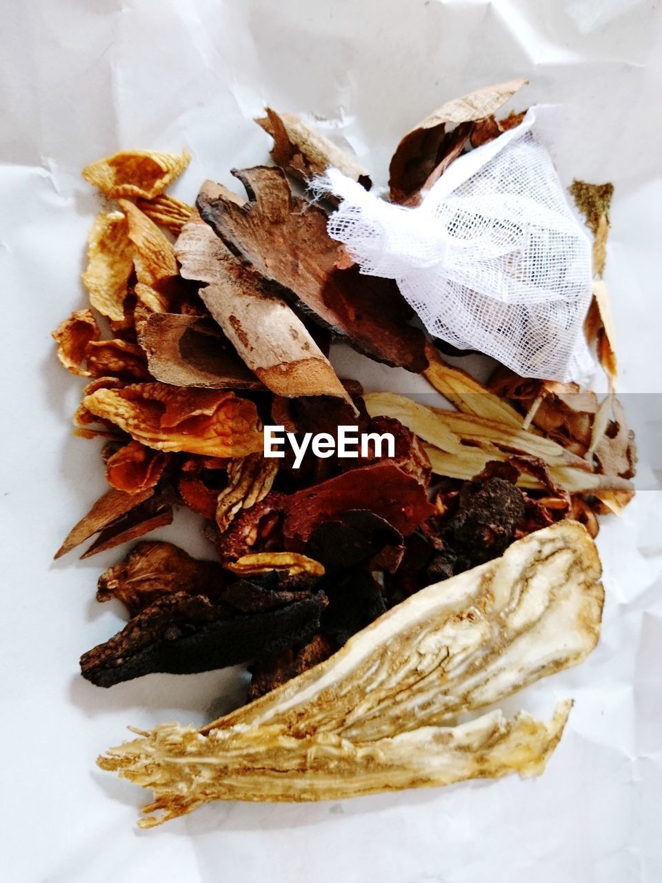 HIGH ANGLE VIEW OF DRIED MEAT ON WHITE