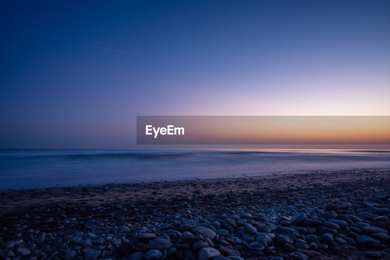 SCENIC VIEW OF SEA DURING SUNSET