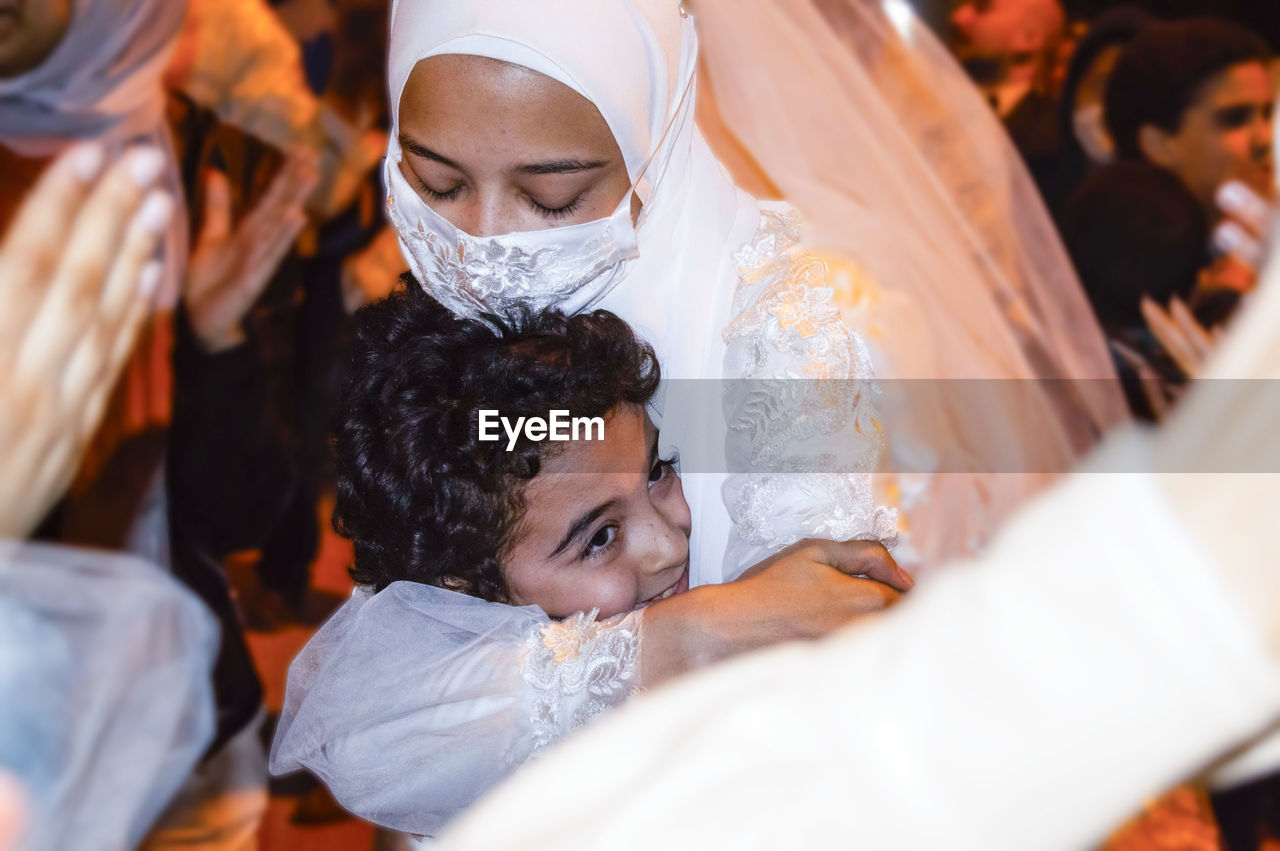 Alaa with her little brother aser in her wedding day