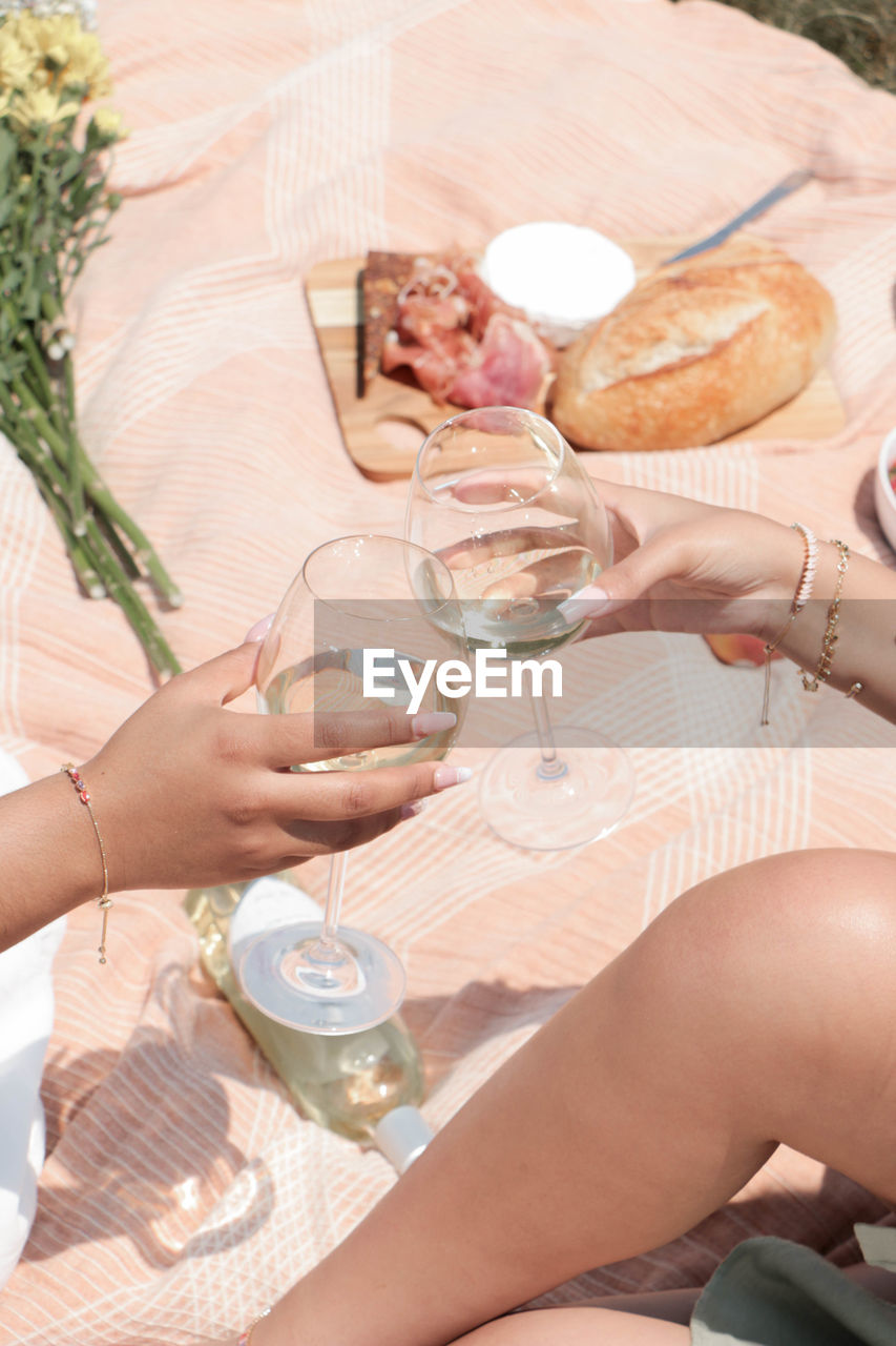 cropped hands of woman preparing food at table