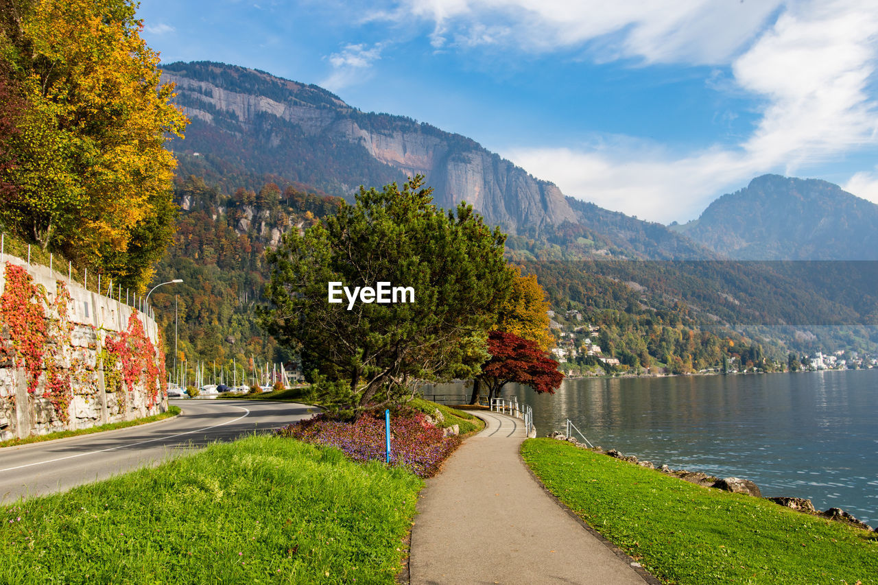 Scenic view of mountains against blue sky