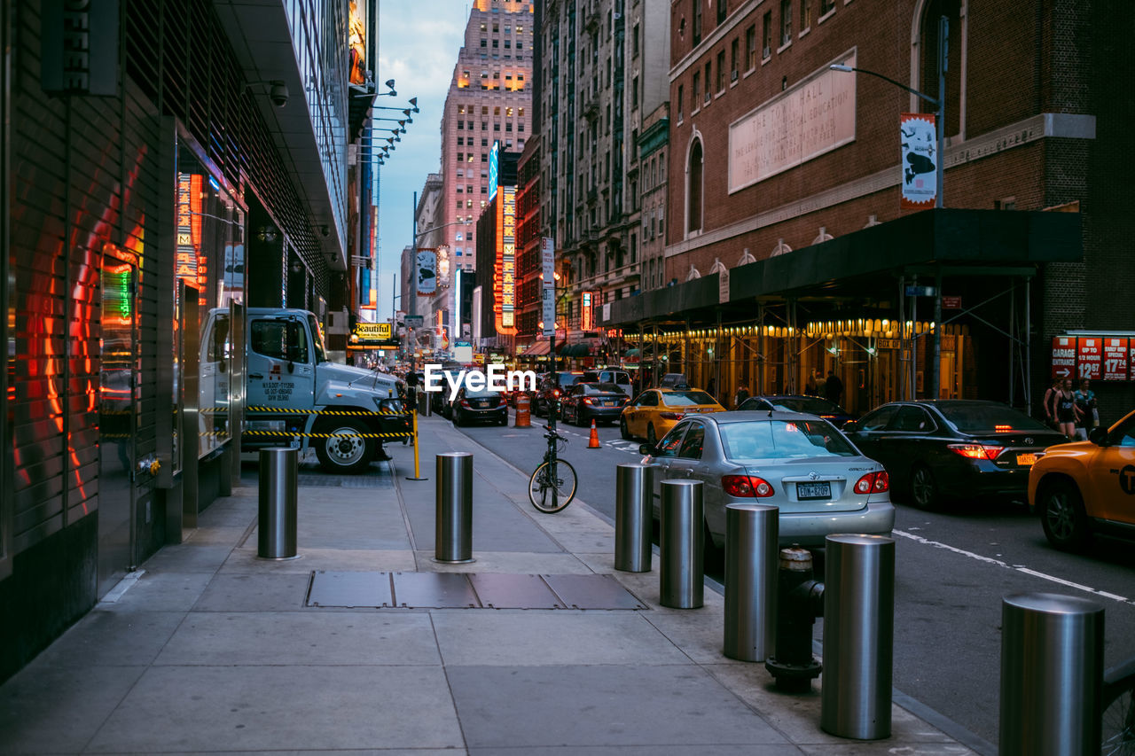 CITY STREET BY BUILDINGS