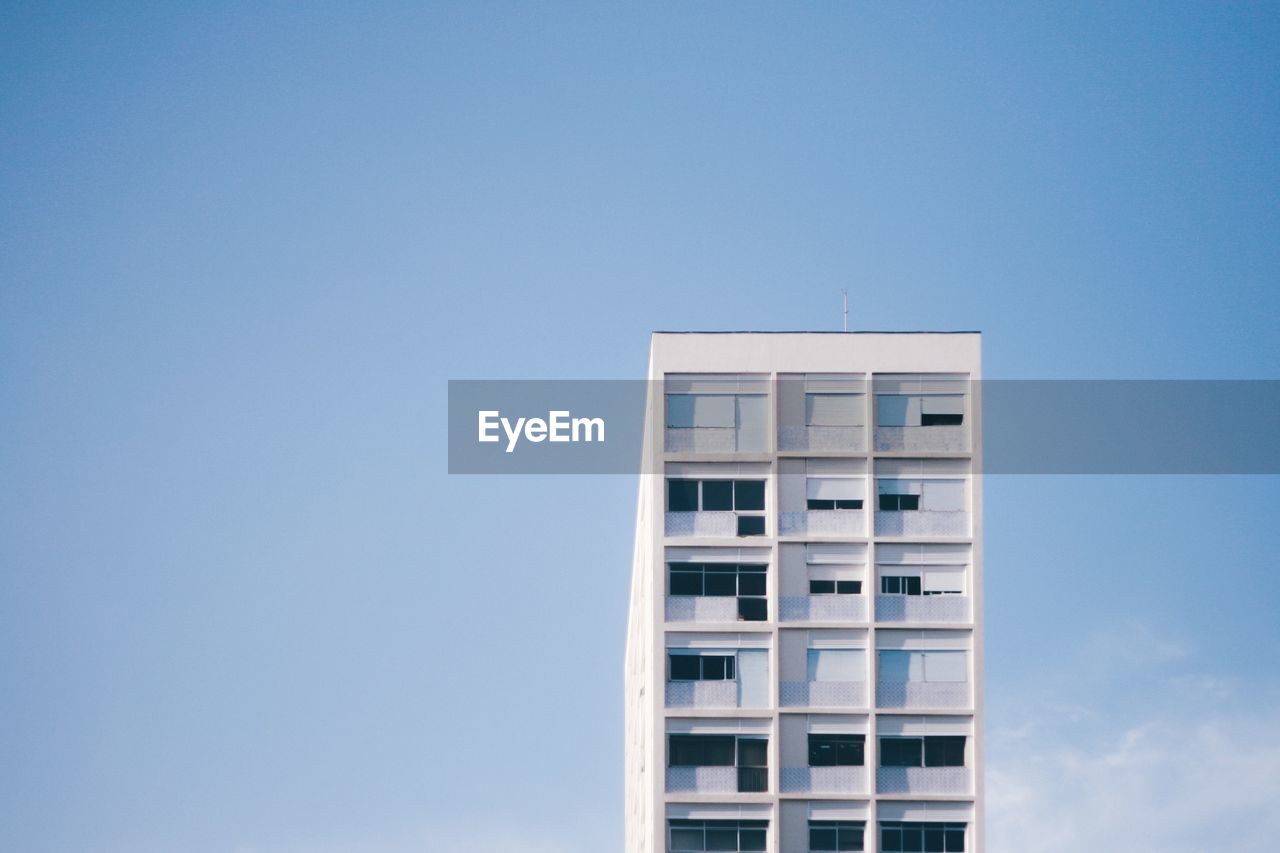 Low angle view of building against blue sky