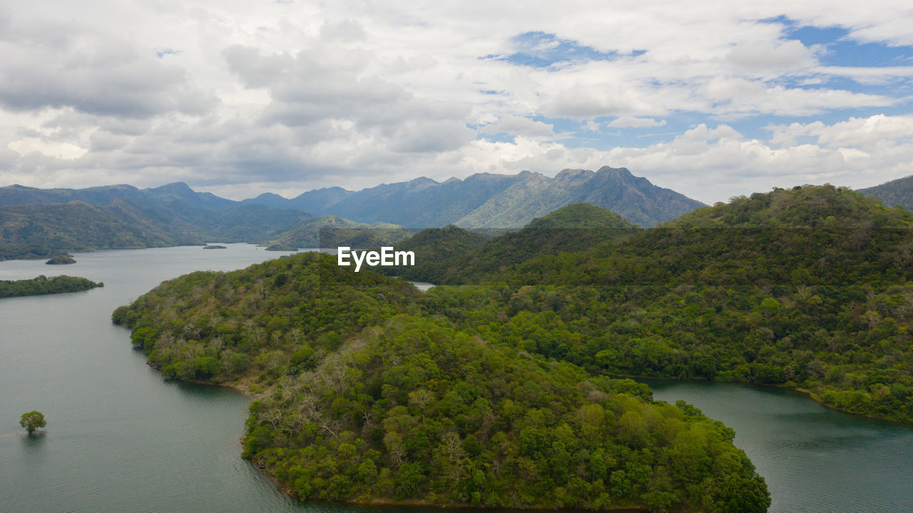 Tropical landscape a lake surrounded by mountains and jungle. randenigala reservoir.