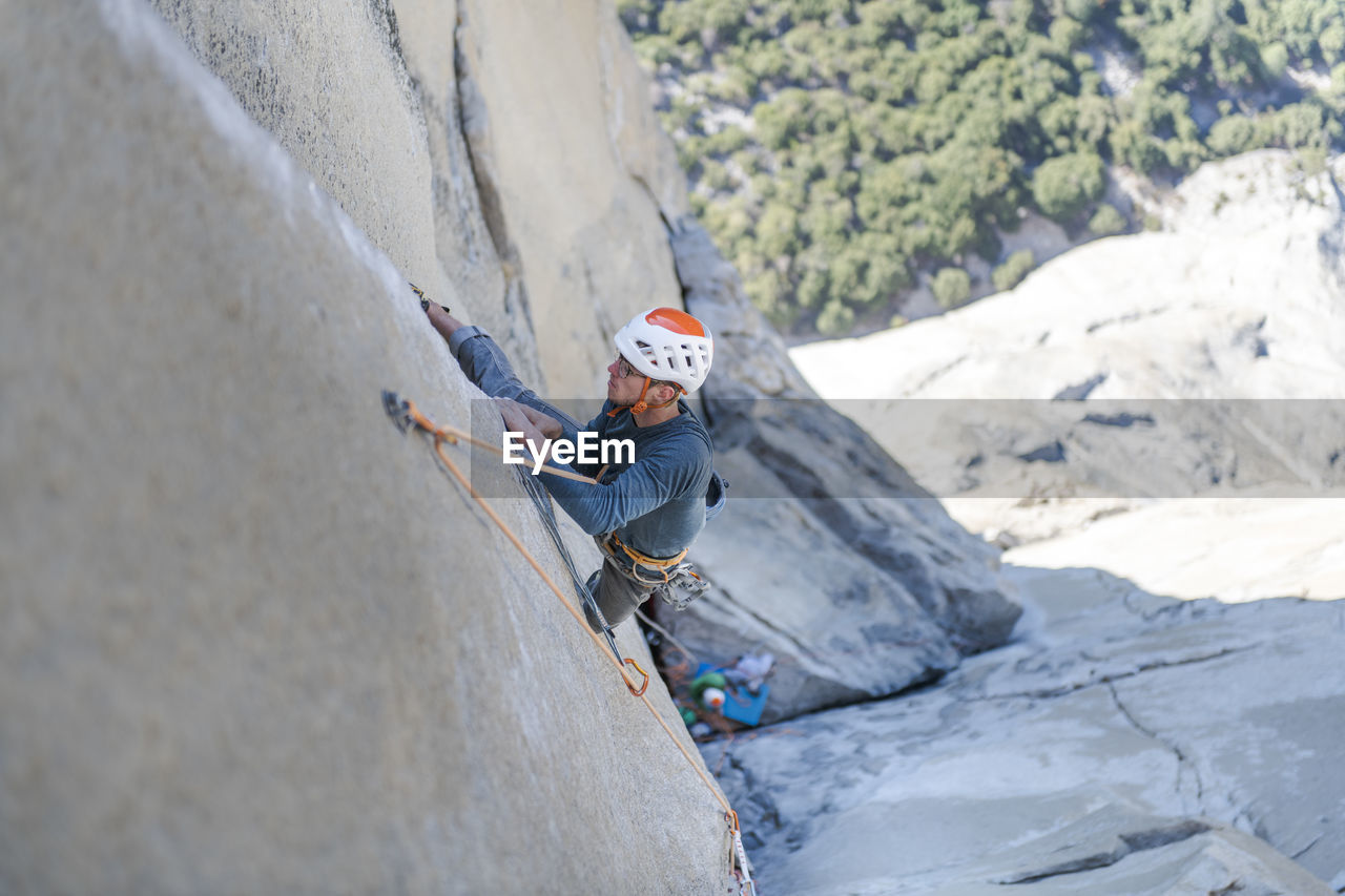 Rock climber crack climbing on the nose, el capitan in yosemite