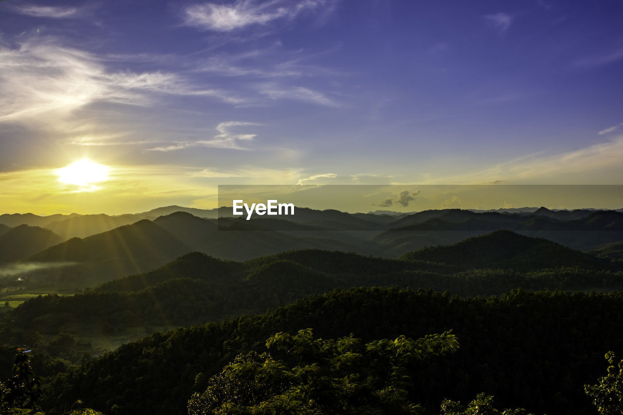 Scenic view of mountains against sky during sunset