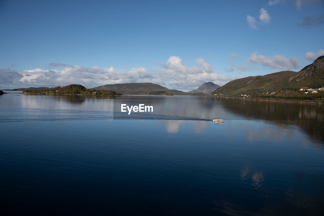 reflection, water, mountain, scenics - nature, sky, lake, beauty in nature, body of water, mountain range, tranquil scene, tranquility, nature, reservoir, cloud, environment, landscape, no people, blue, travel destinations, dusk, land, travel, morning, non-urban scene, day, outdoors, idyllic, snow