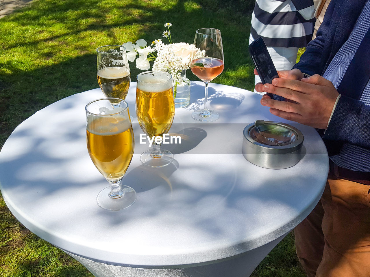 DRINKING GLASS ON TABLE IN PLATE